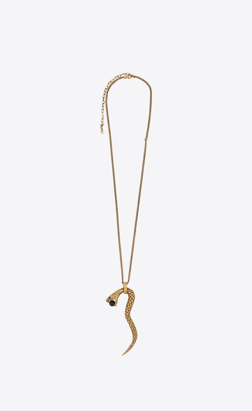 Pendentif SERPENT en métal doré et perle de verre noire.